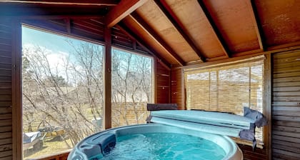 Dog-friendly home with indoor hot tub, fireplace, great views & pool access