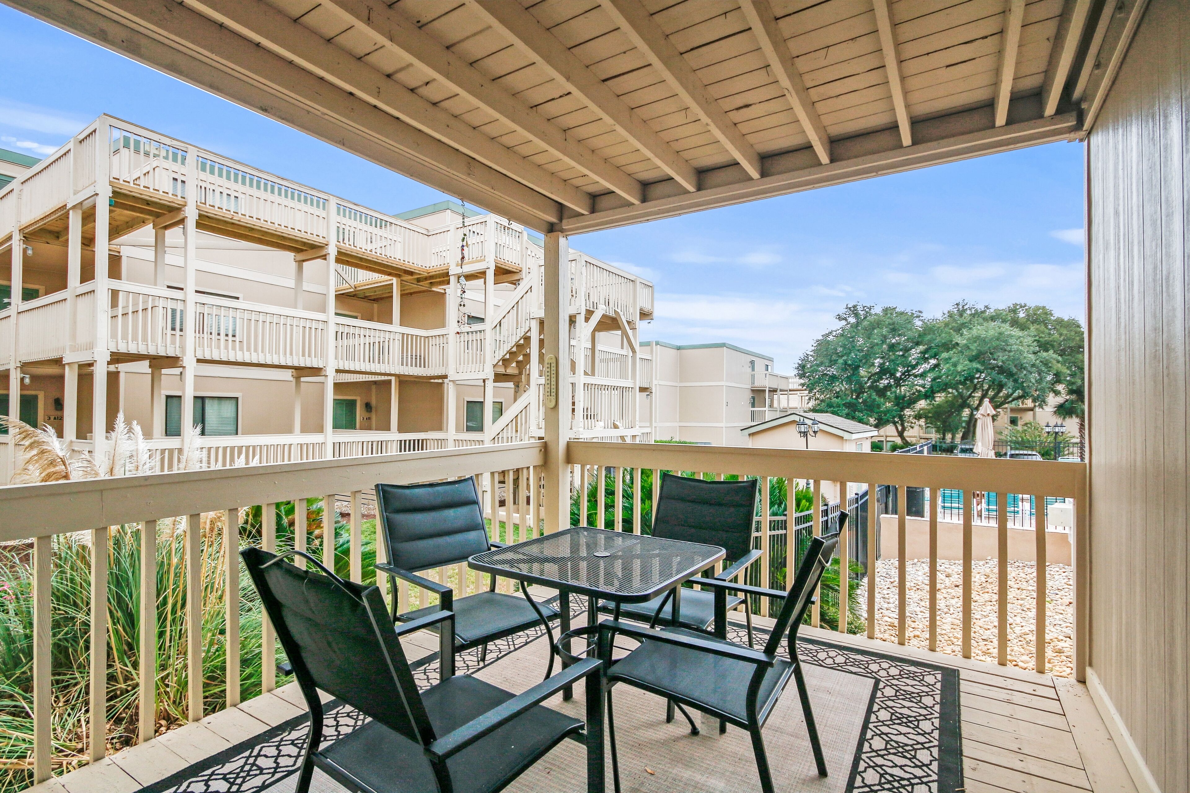 Coastal condo with deck, central AC, WiFi, & on-site pool - walk to beach & pier