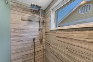 Combined shower/tub, hair dryer, towels, soap