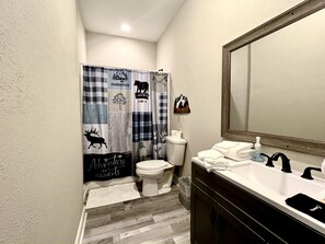 Combined shower/bathtub, hair dryer, towels, soap