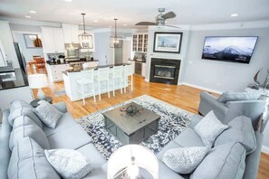 Smart TV, fireplace, books, offices