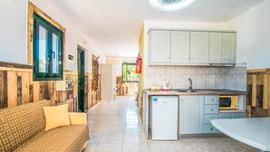 A compact kitchen with a refrigerator, microwave, and sink. - 'Mirage Arillas Studio Type A9' next to Beach with Balcony, Shared Pool & Wi-Fi (corfu)
