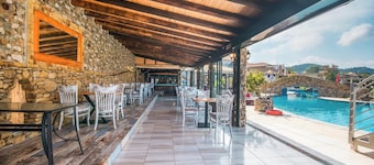 Holiday Studio 'Mirage Arillas Maisonette A' next to Beach with Balcony, Shared Pool & Wi-Fi