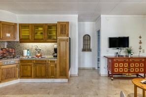 Fridge, microwave, stovetop, coffee/tea maker
