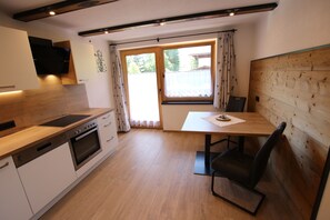 Fridge, stovetop, dishwasher, coffee/tea maker