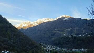 A mountainous landscape with a village nestled in the valley.