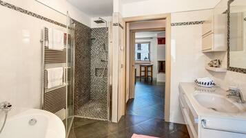 Bathtub, hair dryer, towels