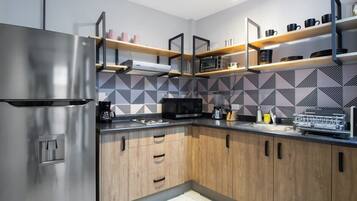 Fridge, microwave, stovetop, coffee/tea maker