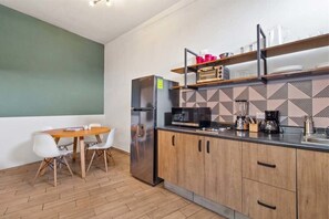 Fridge, microwave, stovetop, coffee/tea maker