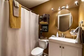 Bathtub, hair dryer, towels, soap