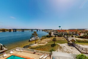 Overlooking the river, this hotel offers a pool area with a scenic view of the bridge connecting two land masses.