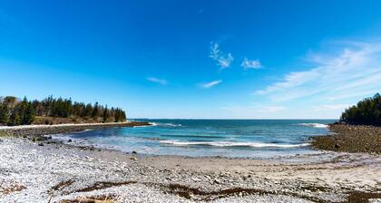 Tranquil getaway on the coast with beach access, ocean views, & screened porch