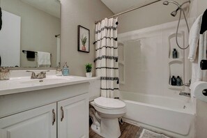 Combined shower/tub, hair dryer, towels, soap