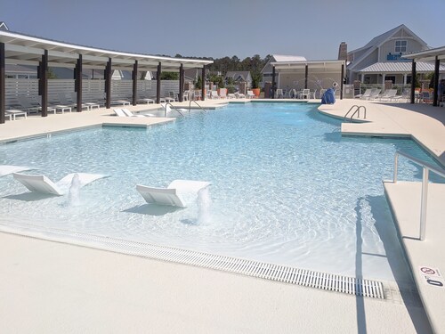 Enjoy sea breezes from double-decker porch -  walk to pool, private waterfront.