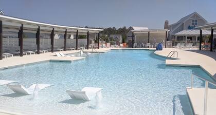 Enjoy sea breezes from double-decker porch - walk to pool, private waterfront.