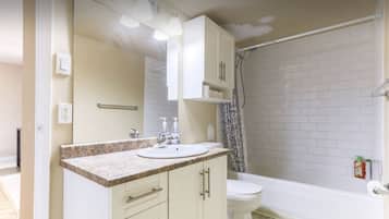 Combined shower/bathtub, towels, soap, shampoo