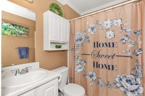 Combined shower/tub, towels, soap, shampoo