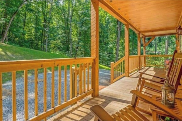Relax on the deck, surrounded by lush greenery and the natural beauty of the forest.