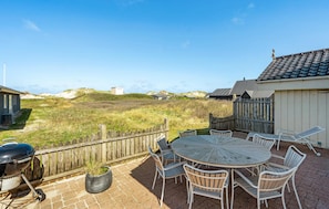 Enjoy al fresco dining on the patio with a barbecue grill and comfortable seating for six.