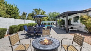 A patio with a fire pit, outdoor seating, and a pool. - Spring Song: Location, Style, Pool, Firepit, BBQ! (Scottsdale)