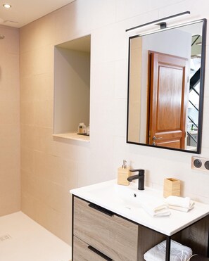 Shower, hair dryer, towels, soap