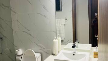 Shower, hair dryer, towels, soap