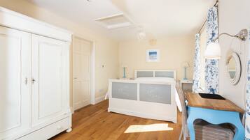 1 bedroom, desk, iron/ironing board, travel crib