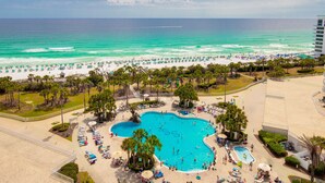 A resort with a large pool area, beach access, and a view of the ocean. - Ocean Aire Gulf Front Condo, Resort, Pool (Destin)