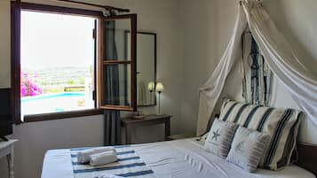 Villa Irida, Shared Pool, 4 Bedrooms | Individually furnished, blackout drapes, iron/ironing board, free WiFi