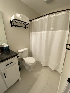 Combined shower/bathtub, hair dryer, towels, soap