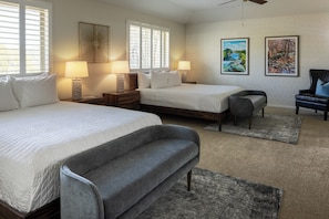 A hotel room with two beds, a grey sofa, a small armchair, and two wall-mounted lamps. - Your Own High-End Resort. 1-Story, HeatedPool+HotTub, BigBeds, GameRoom, FirePit (Canyon Lake)