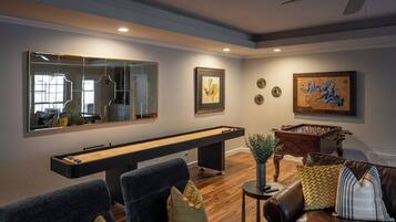 Smart TV, fireplace, foosball, books