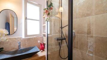 Shower, hair dryer, towels, toilet paper