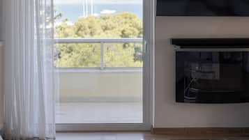 Comfort Apartment | Living area | 55-inch Smart TV with satellite channels, TV, Netflix