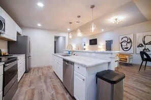 Microwave, dishwasher, coffee/tea maker, cookware/dishes/utensils