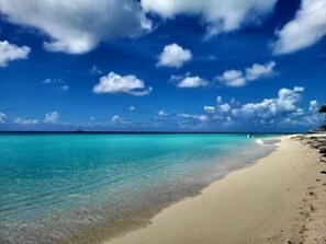 A beach with clear turquoise water and a sandy shore. - Beach front vacation rental - perfect for families! (Bimini)