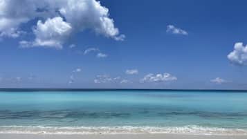 On the beach, sun loungers, beach towels
