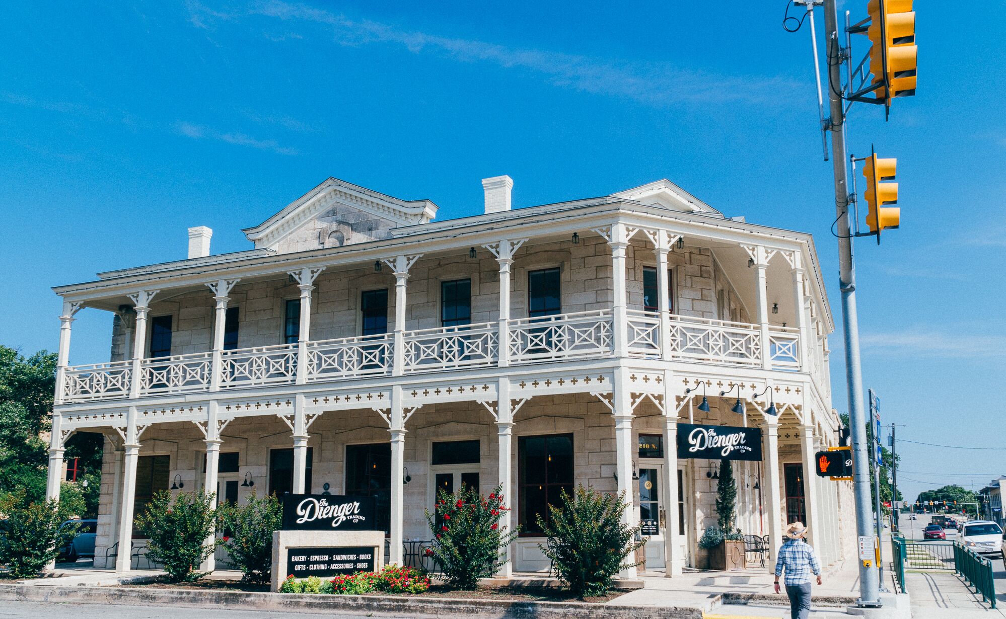A two-story building with a balcony and a sign reading "The Dierger."