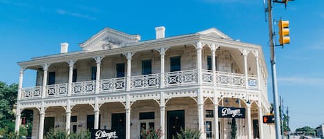 A two-story building with a balcony and a sign reading "The Dierger."