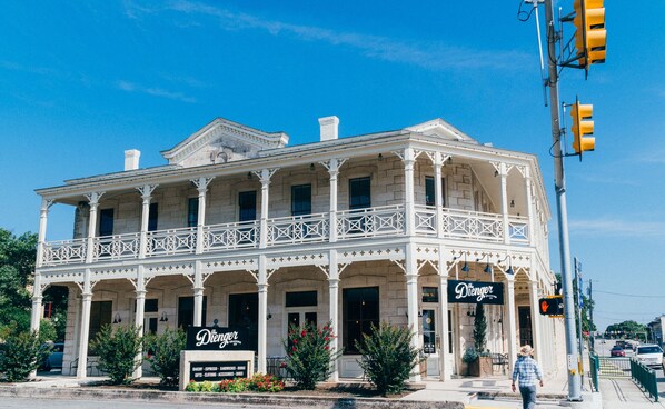 A two-story building with a balcony and a sign reading "The Dierger."