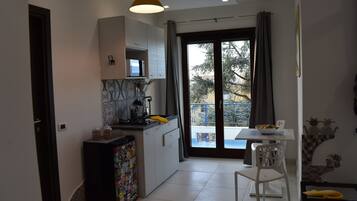 Comfort Apartment | Living area | 32-inch TV with cable channels