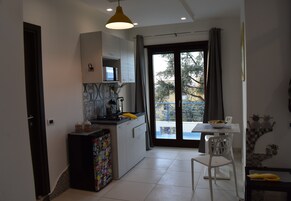 Comfort Apartment | Living area | 32-inch TV with cable channels