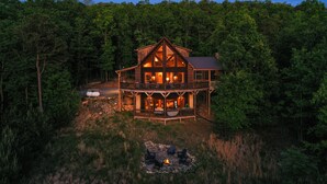 A large wooden cabin with a balcony, surrounded by dense forest. - Cascading View Lodge♡ Mtn Views, hot tub, fire pit, < 20 min from Blue Ridge (Blue Ridge)