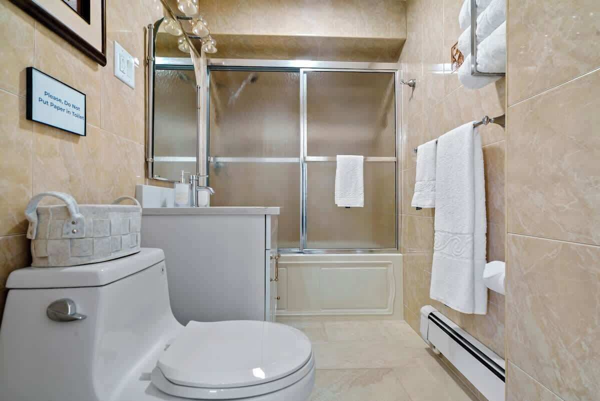 Combined shower/tub, hair dryer, towels, soap