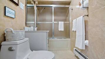 Combined shower/tub, hair dryer, towels, soap