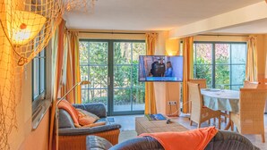 A cozy living room with a TV, comfortable seating, and large windows. - 2 bedroom gorgeous home in Zierow OT Eggerstorf (Zierow OT Eggerstorf)