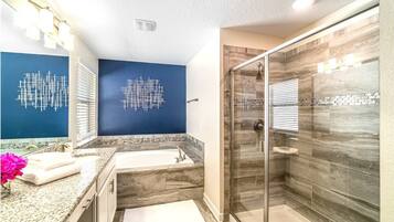 Combined shower/tub, hair dryer, towels, soap
