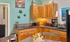Fridge, microwave, stovetop, coffee/tea maker