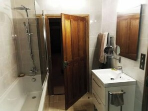 Bathtub, hair dryer, towels, soap