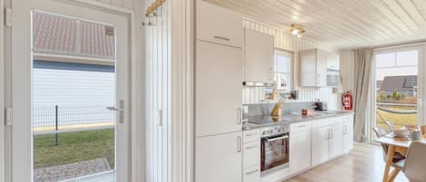 Fridge, stovetop, dishwasher, coffee/tea maker